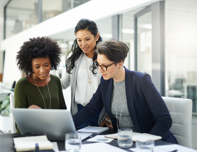 three-women-looking-at-laptop-screen
